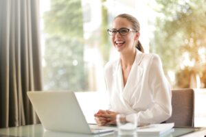 a smiling woman finds success with her LVM One Software package